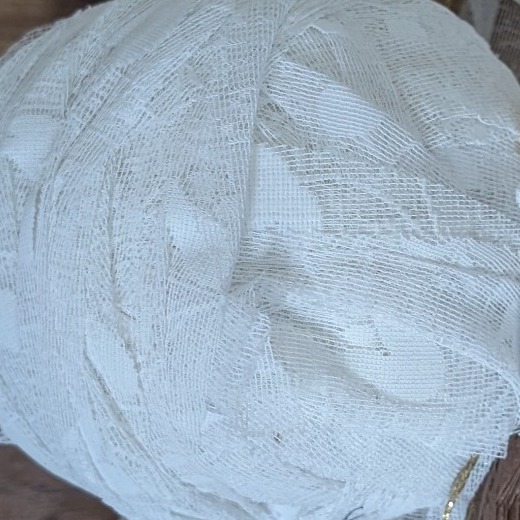 Close-up of donated net curtain fabric