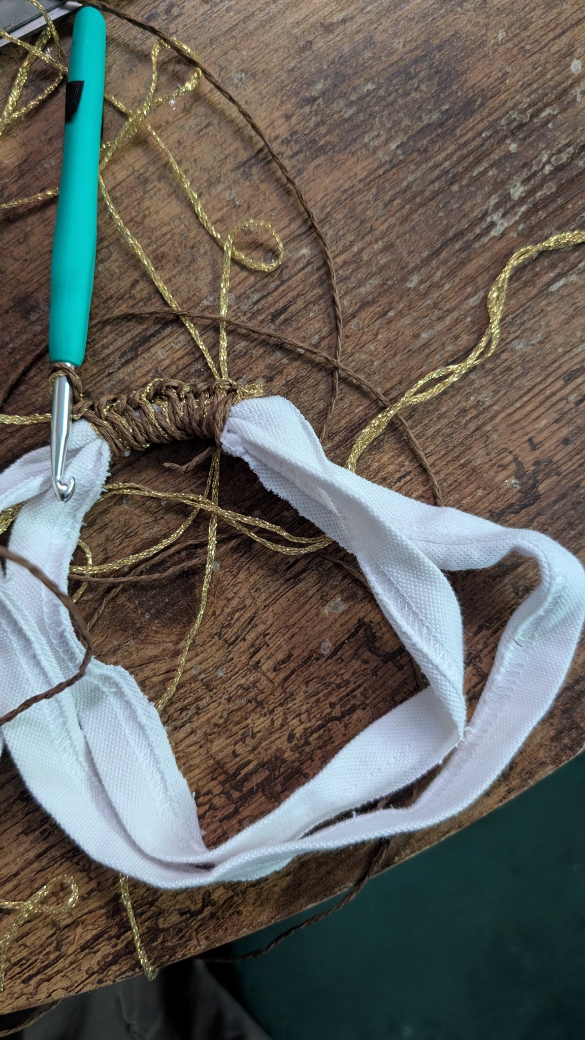The early crochet stage of the bag using reclaimed light textile strips