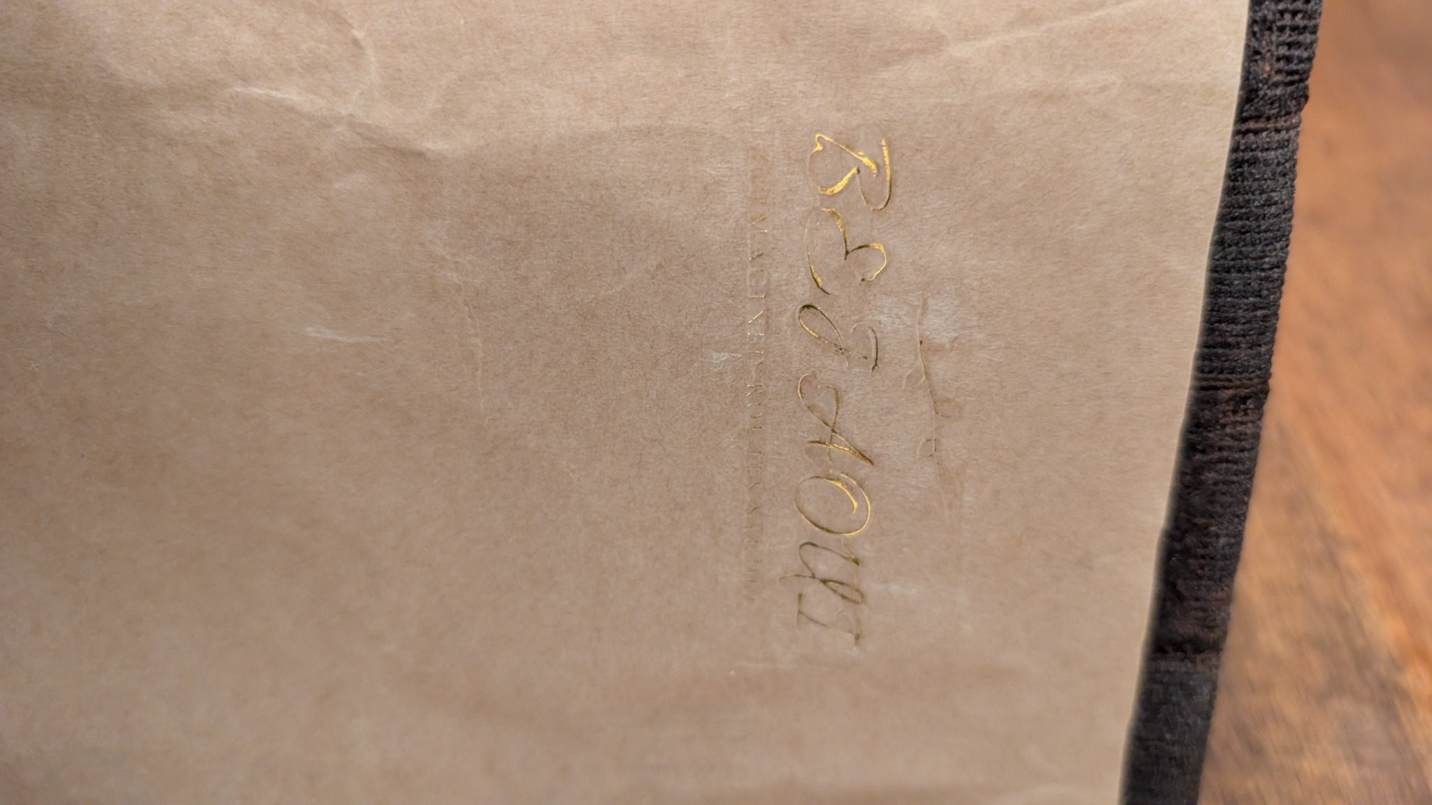 Close-up of the upcycled envelope used to line the notebook cover