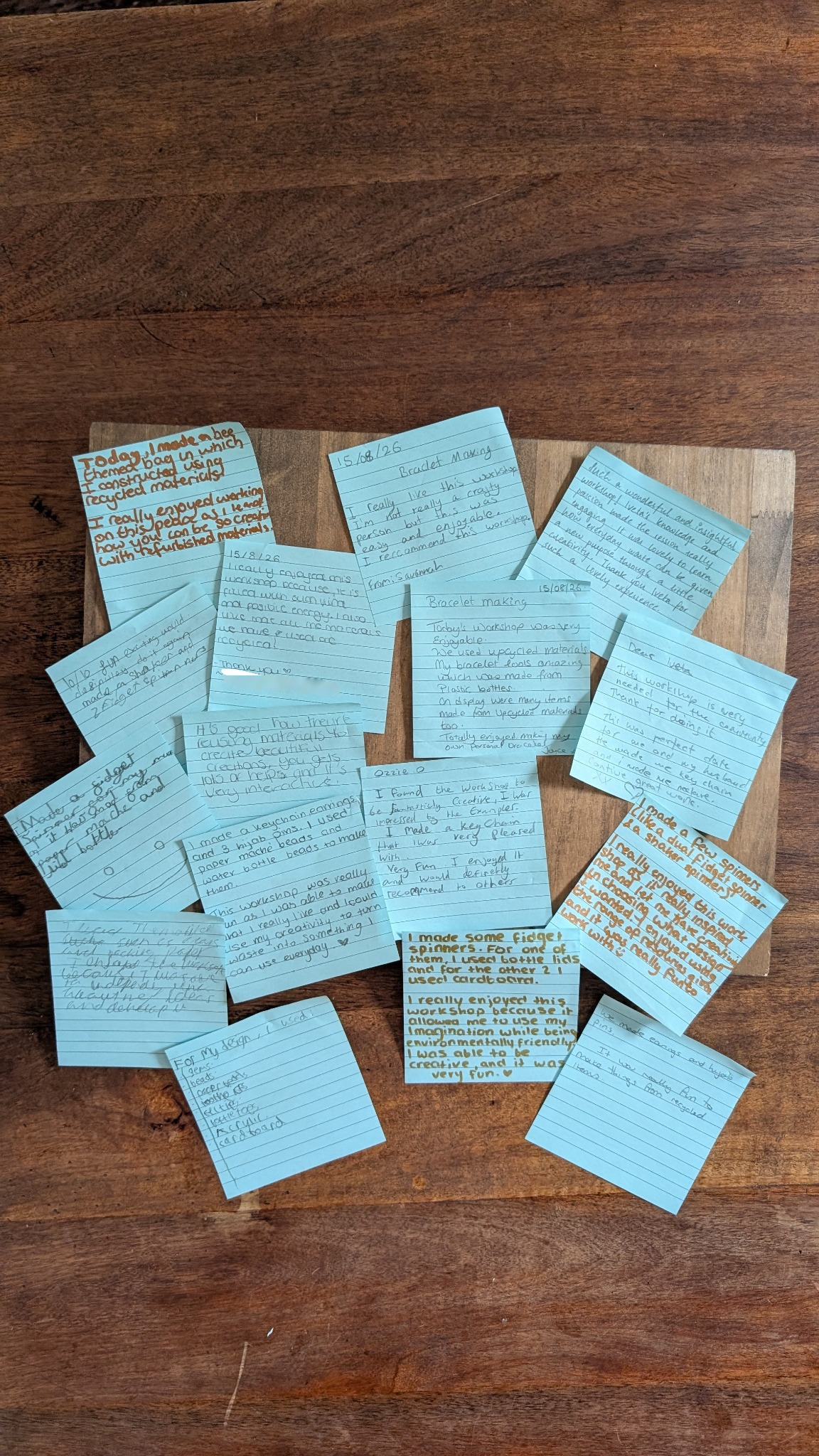 Handwritten feedback from Summer Waste to Treasure Workshops arranged on blue notes